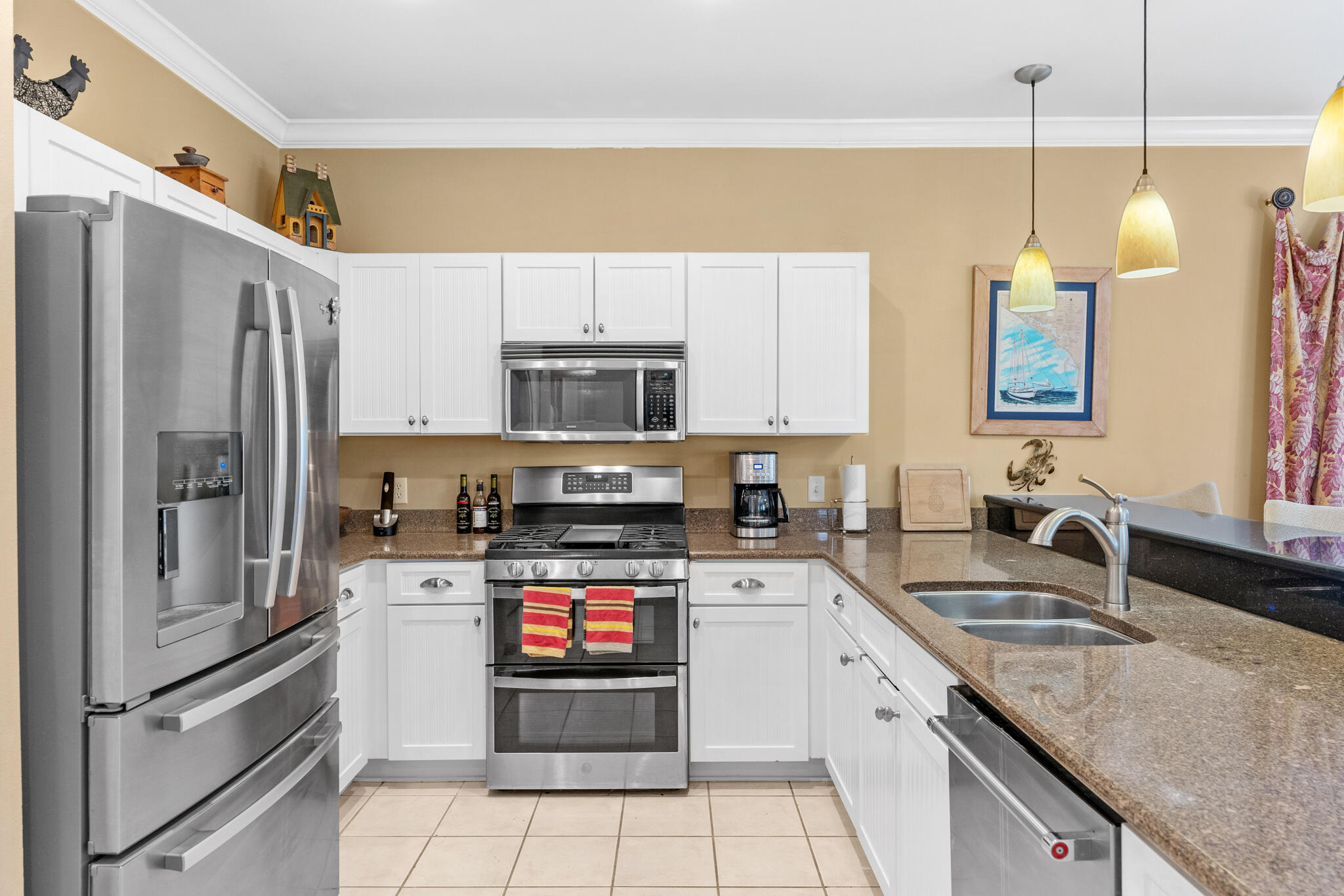 64 Spotted Dolphin Road Santa Rosa Beach, FL 32459 - Photo 3 of 43 a kitchen with a sink stainless steel appliances and white cabinets