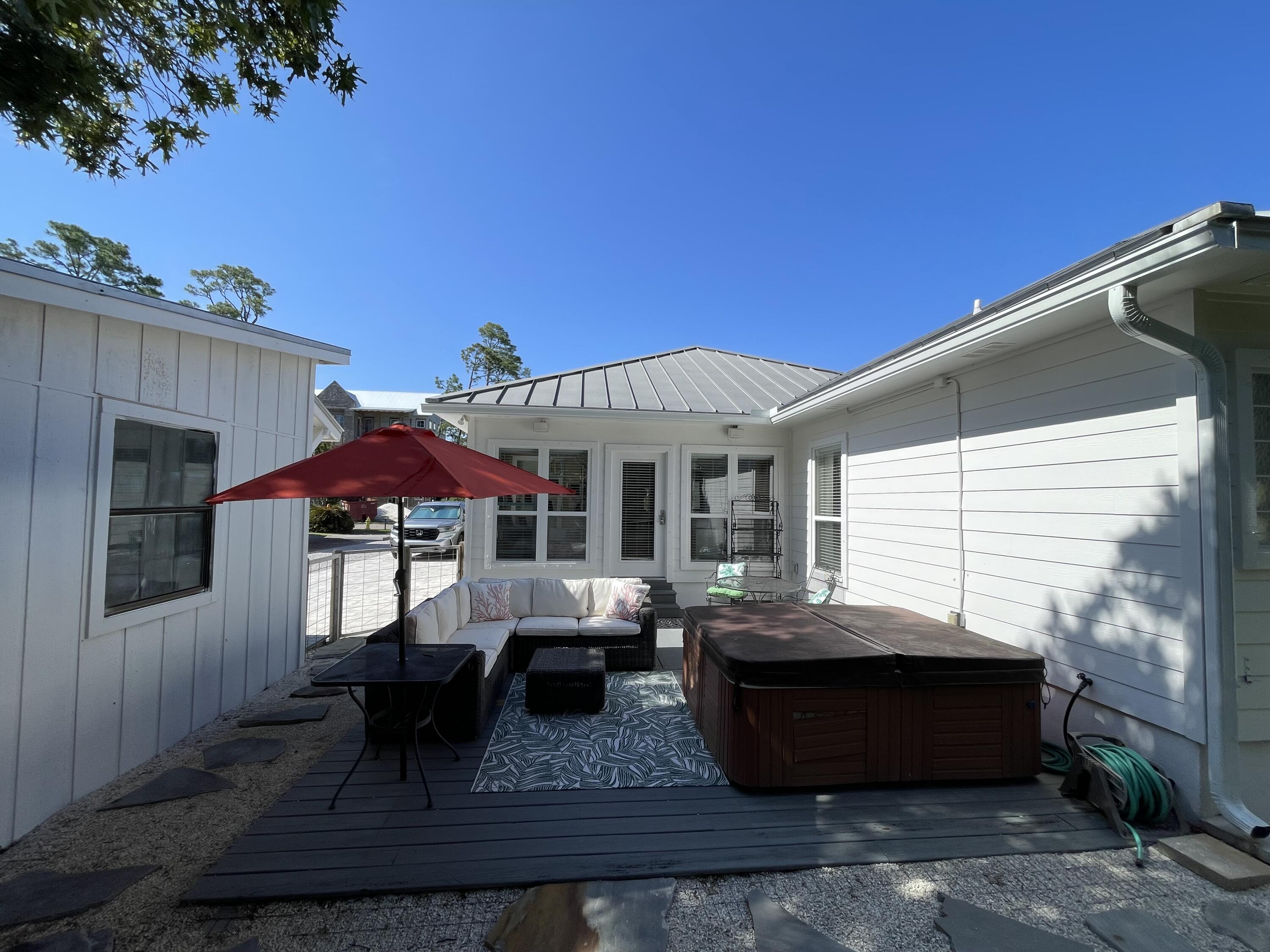 64 Spotted Dolphin Road Santa Rosa Beach, FL 32459 - Photo 32 of 43 a front view of a house with patio