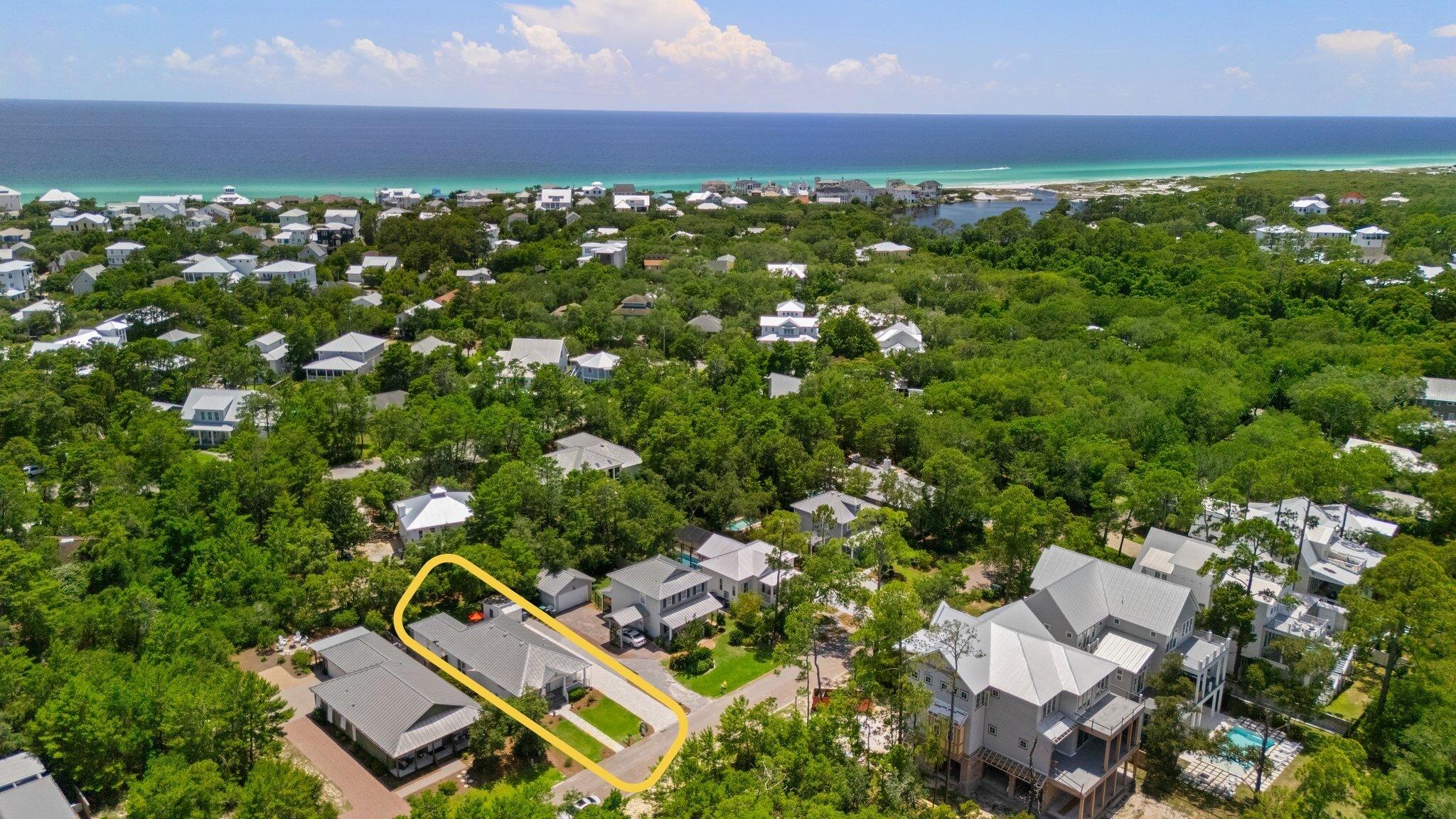 64 Spotted Dolphin Road Santa Rosa Beach, FL 32459 - Photo 5 of 43 an aerial view of residential houses with outdoor space and trees