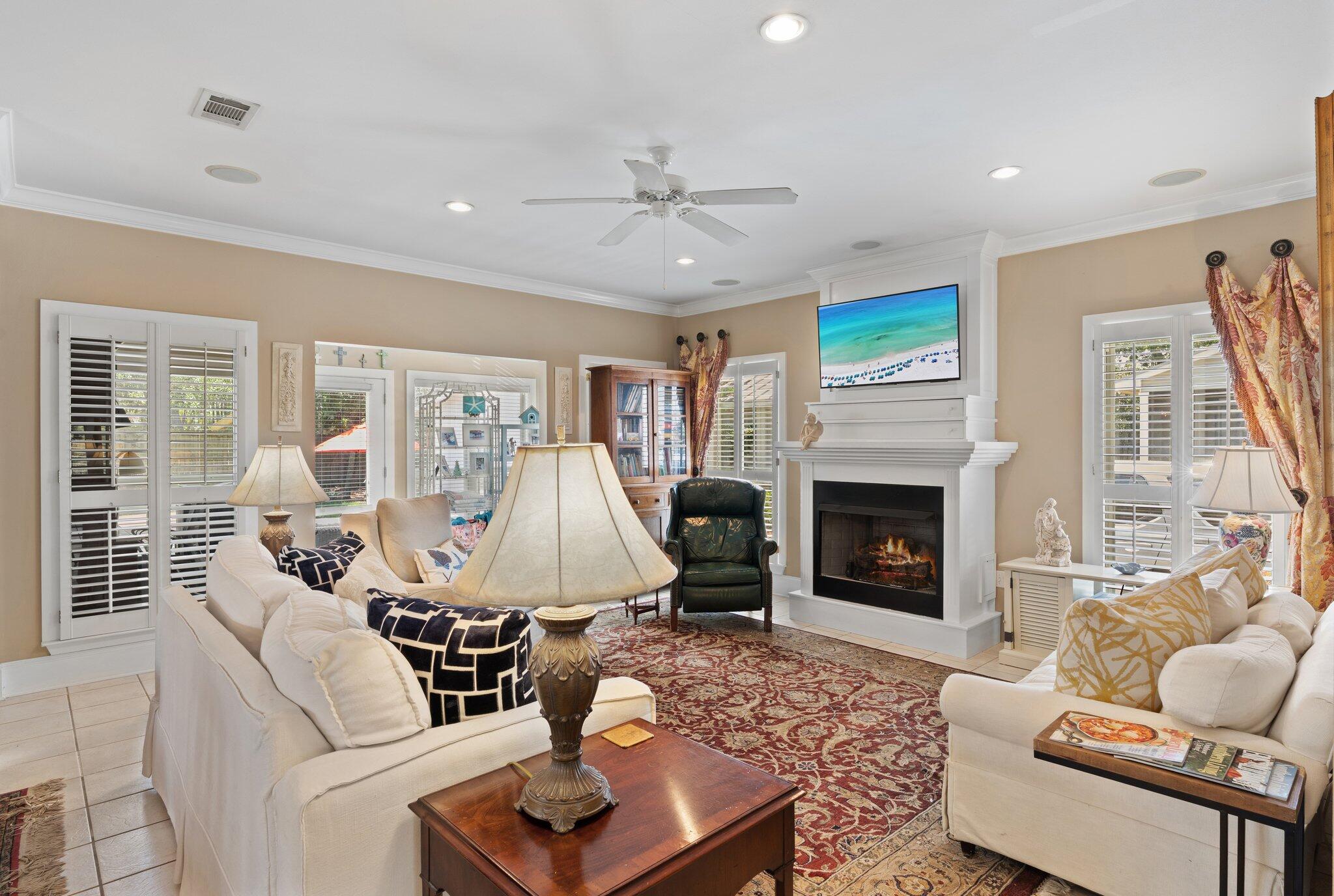 64 Spotted Dolphin Road Santa Rosa Beach, FL 32459 - Photo 10 of 43 a living room with furniture fireplace and a large window