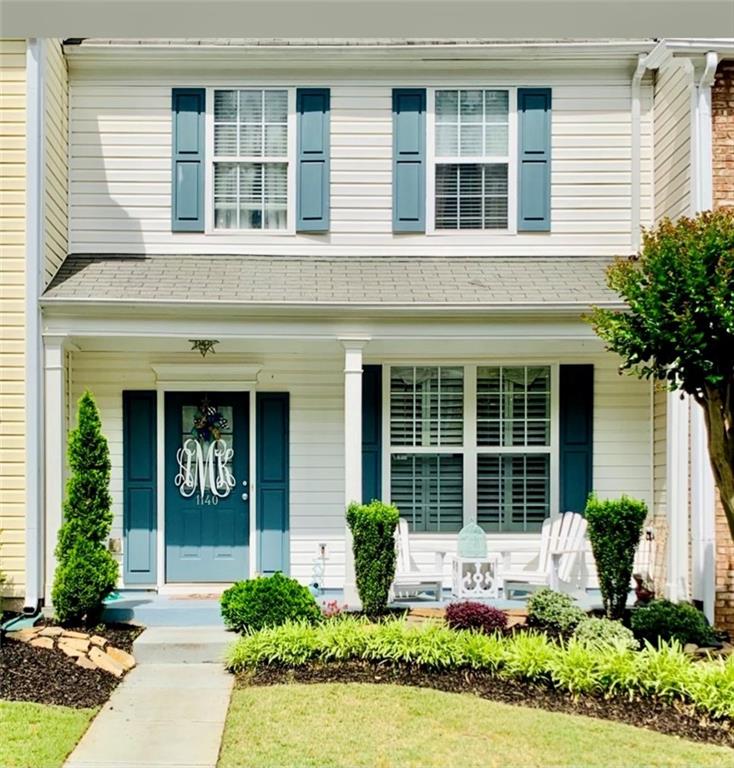1140 Whitestone Ridge Alpharetta, GA 30005 - Photo 1 of 1 a front view of a house with garden and plants