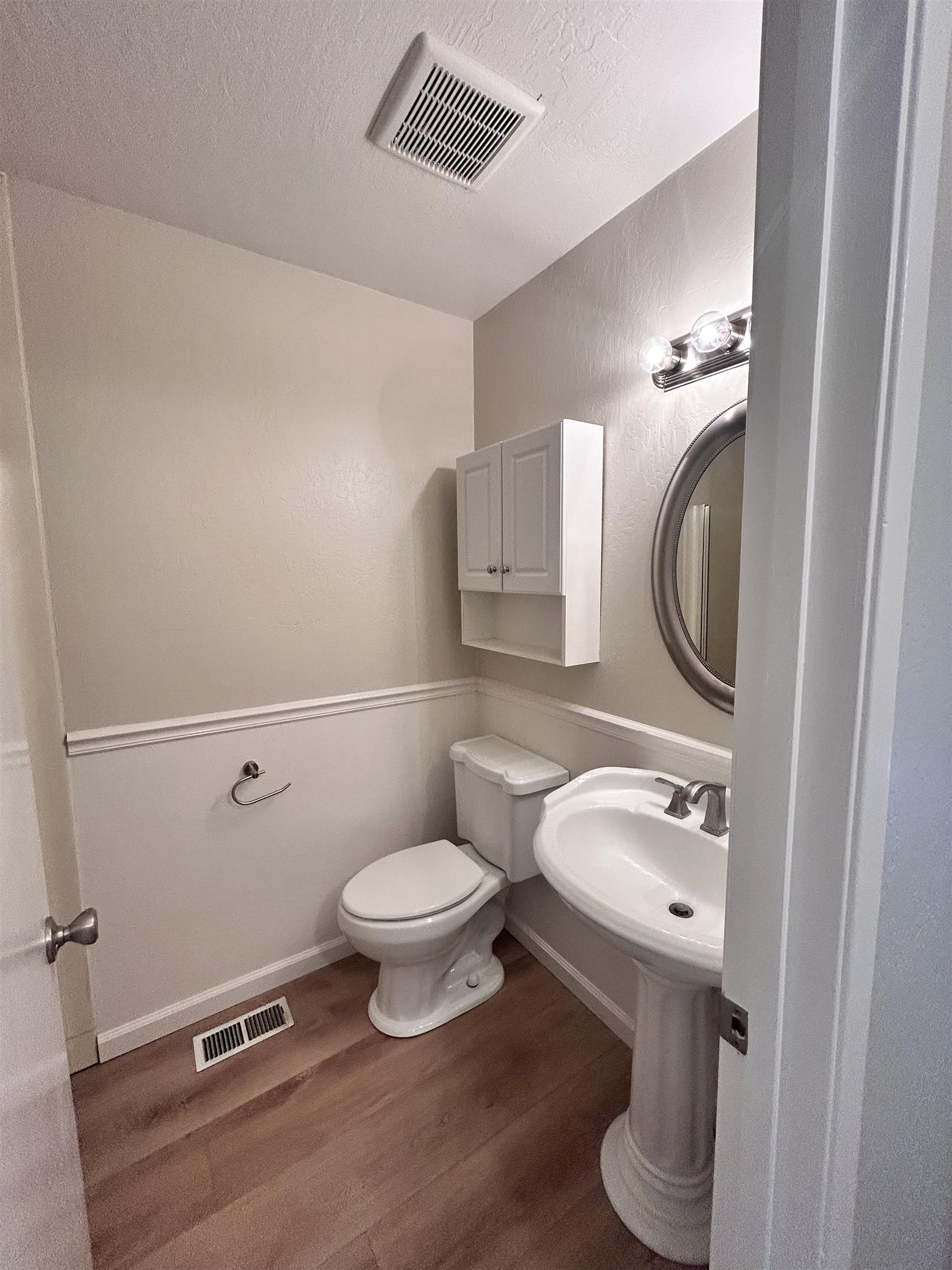 3620 Walnut Street, Unit B Lafayette, CA 94549 - Photo 14 of 26 Half bathroom with dark wood-type flooring, a textured ceiling, and a textured wall