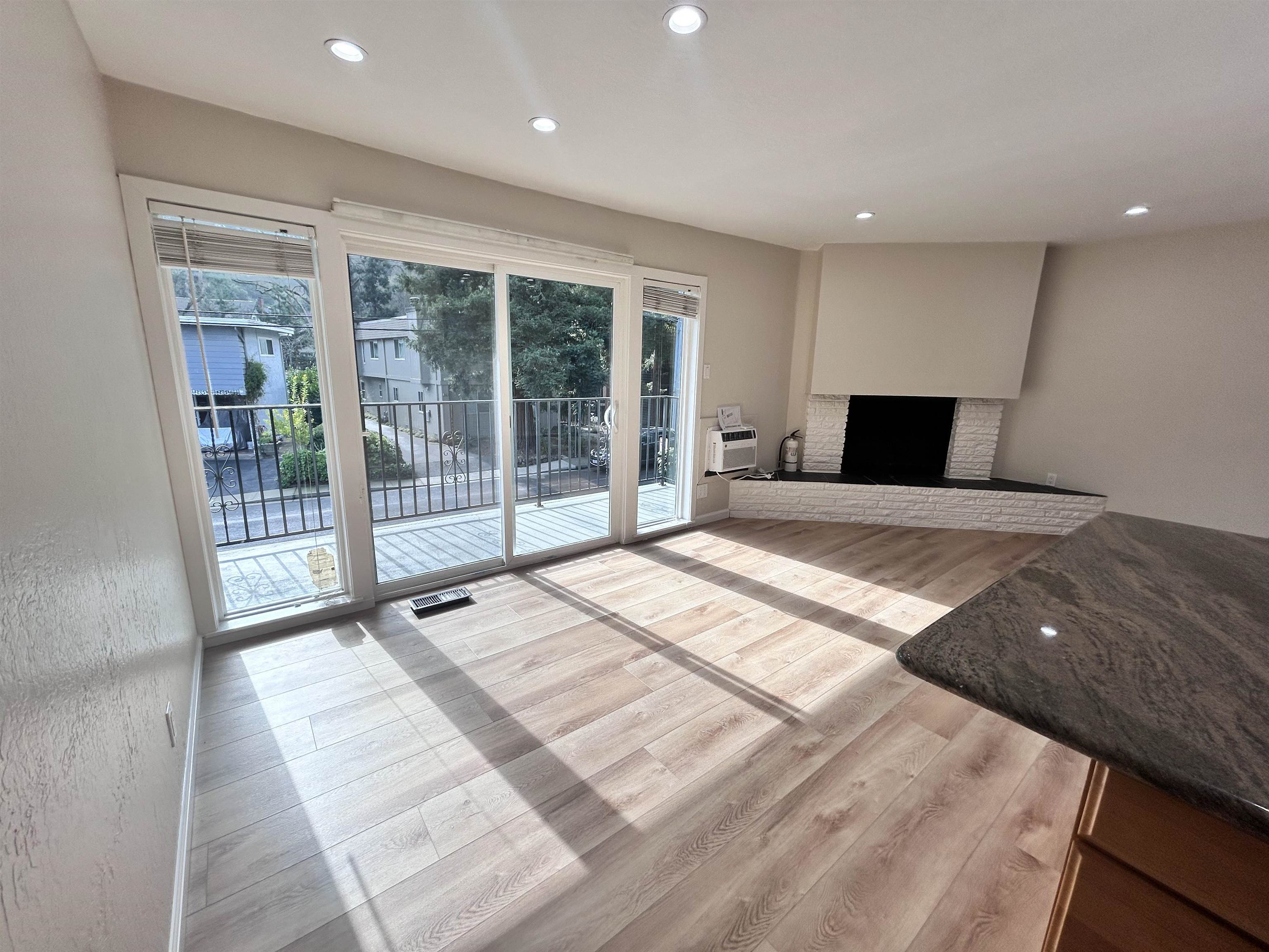 3620 Walnut Street, Unit B Lafayette, CA 94549 - Photo 8 of 26 Unfurnished living room featuring light wood-style flooring, recessed lighting, and a brick fireplace