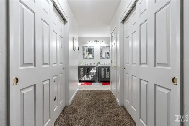 a view of hallway with chandelier
