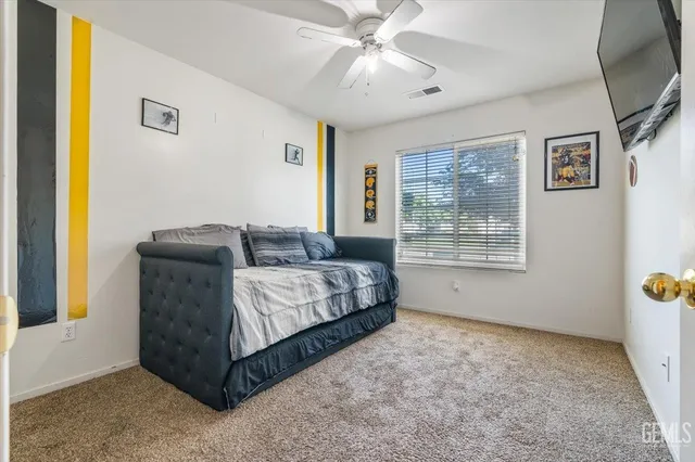a bedroom with a bed and window