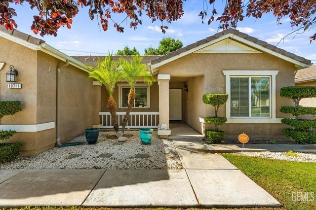 a front view of a house with garden