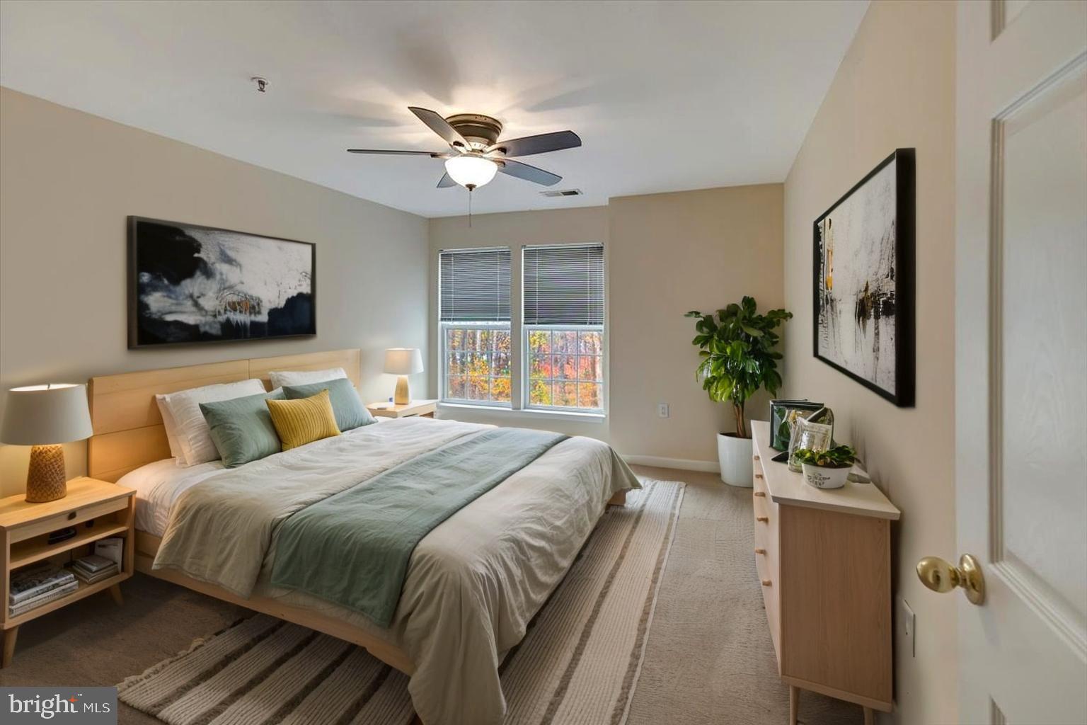 4828 Stone Shop Circle, Unit 4828 Owings Mills, MD 21117 - Photo 12 of 18 a bedroom with a large bed and a chandelier