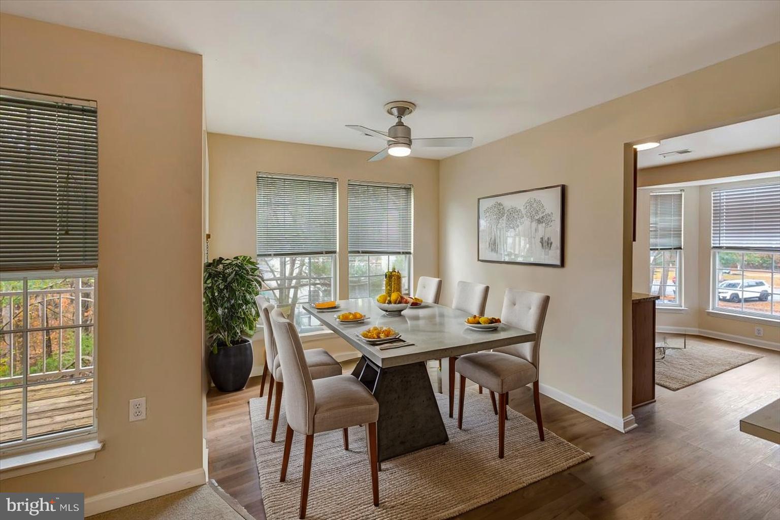 4828 Stone Shop Circle, Unit 4828 Owings Mills, MD 21117 - Photo 8 of 18 a view of a dining room with furniture and wooden floor