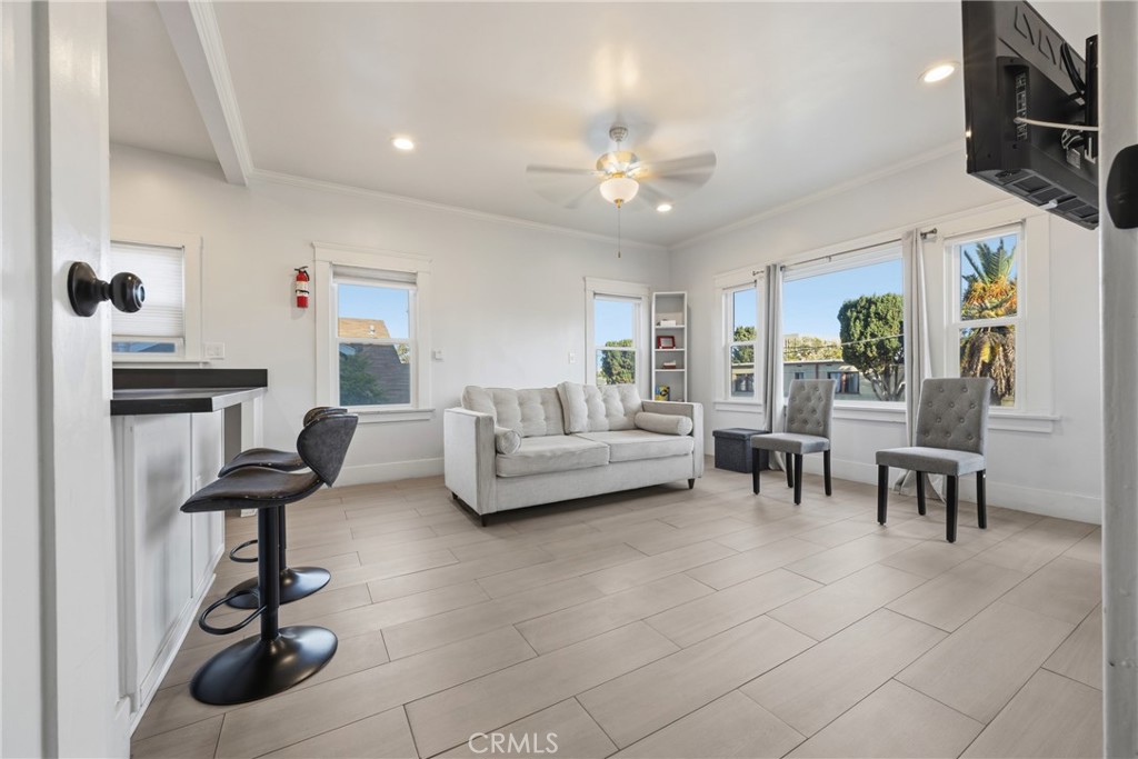 325 East 14th Street Long Beach, CA 90813 - Photo 7 of 21 a living room with furniture and a chandelier