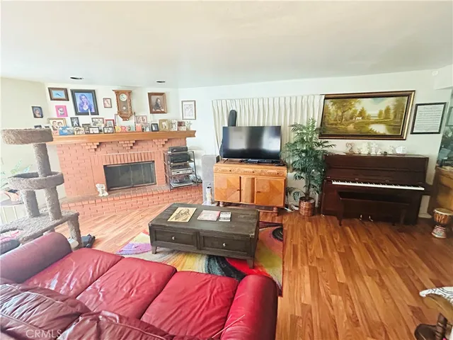 a bedroom with furniture and a flat screen tv