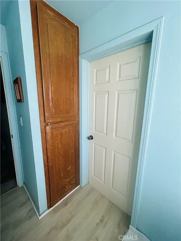 an empty room with wooden door