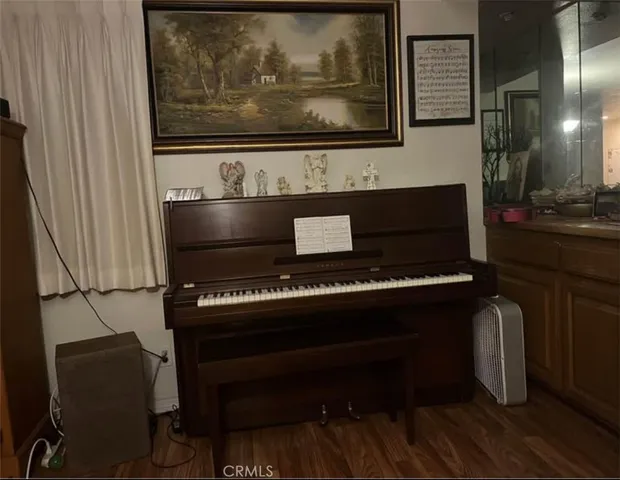 a living room with furniture a rug and a flat screen tv