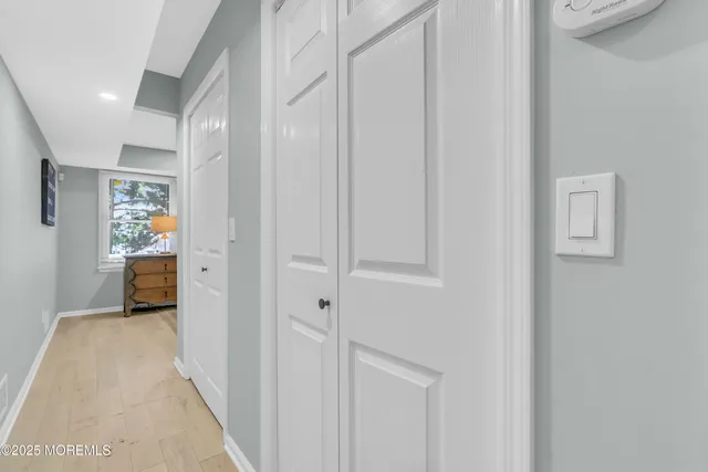 a view of a hallway with a livingroom and a rooms