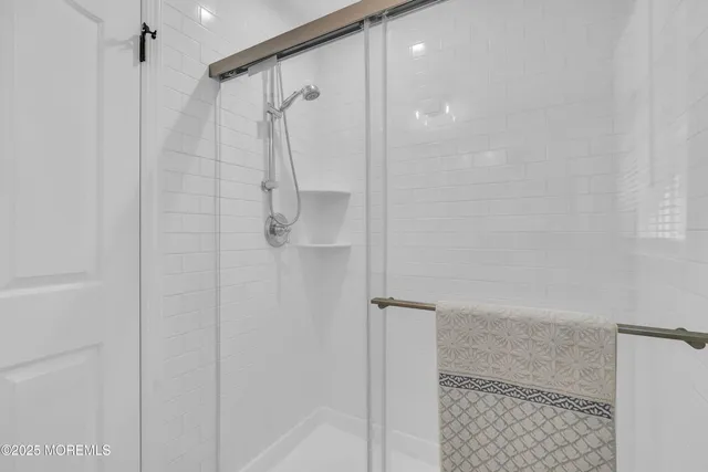 a bedroom with double bed and a window