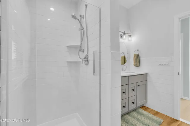 a bathroom with a double vanity sink and a mirror