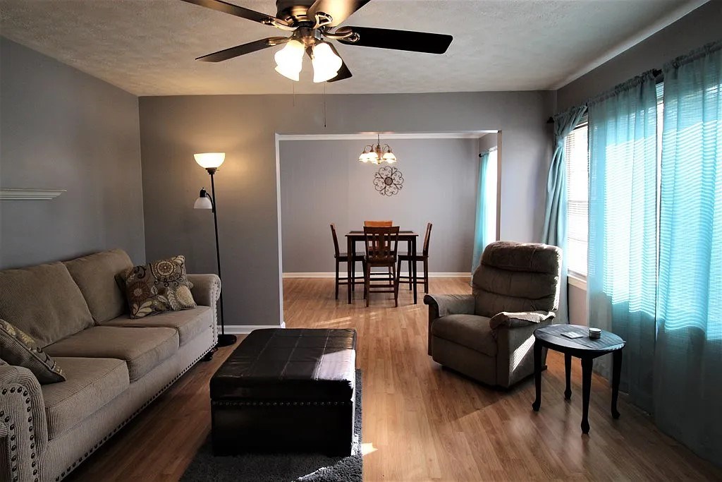 4317 Byron Street Columbus, GA 31907 - Photo 2 of 28 a living room with furniture and a lamp