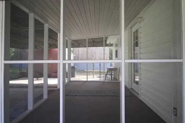 a view of swimming pool with trees in background