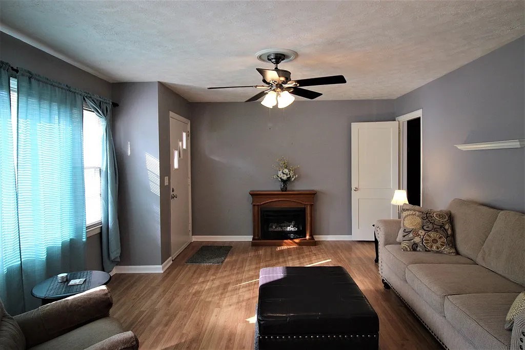 4317 Byron Street Columbus, GA 31907 - Photo 10 of 28 a living room with furniture and a fireplace