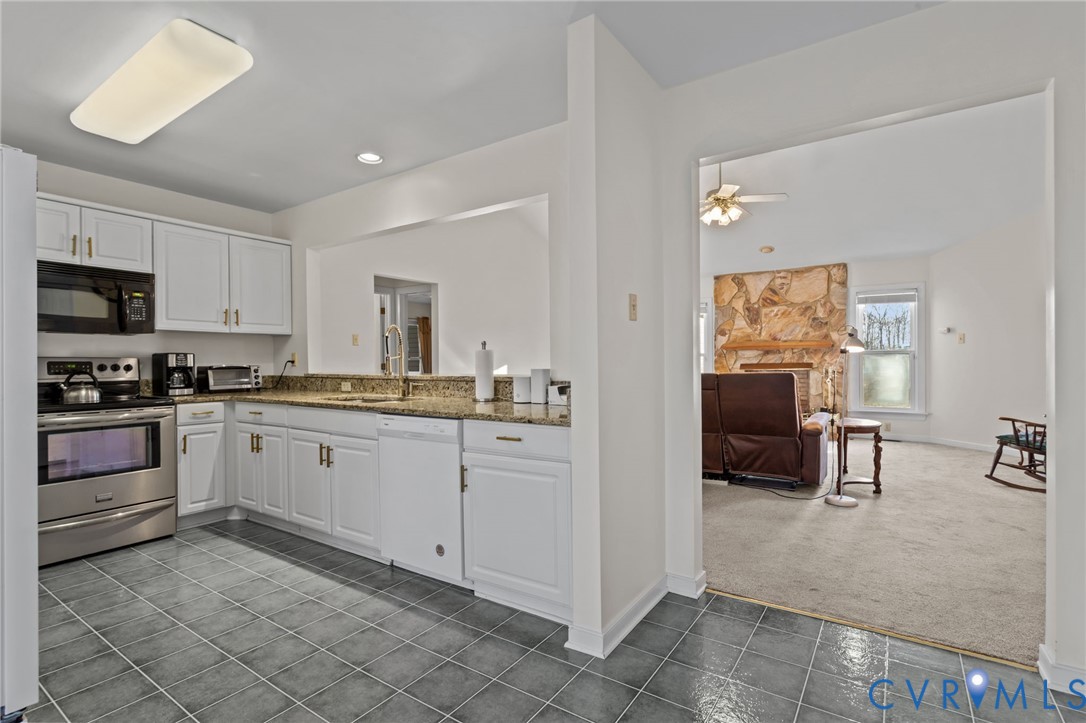 518 Rebel Ridge Road Colonial Heights, VA 23834 - Photo 10 of 44 a kitchen with cabinets and chairs