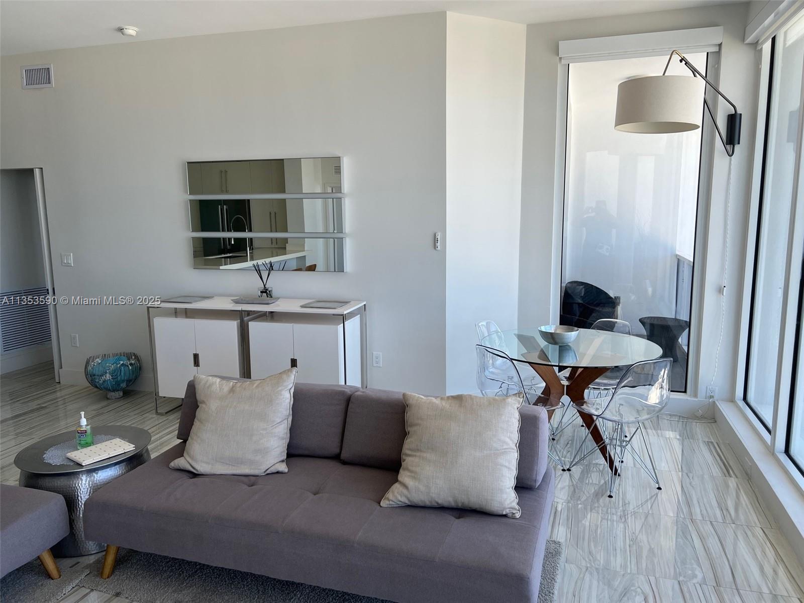 100 Lincoln Road, Unit PH9 Miami Beach, FL 33139 - Photo 16 of 83 a living room with furniture and a flat screen tv