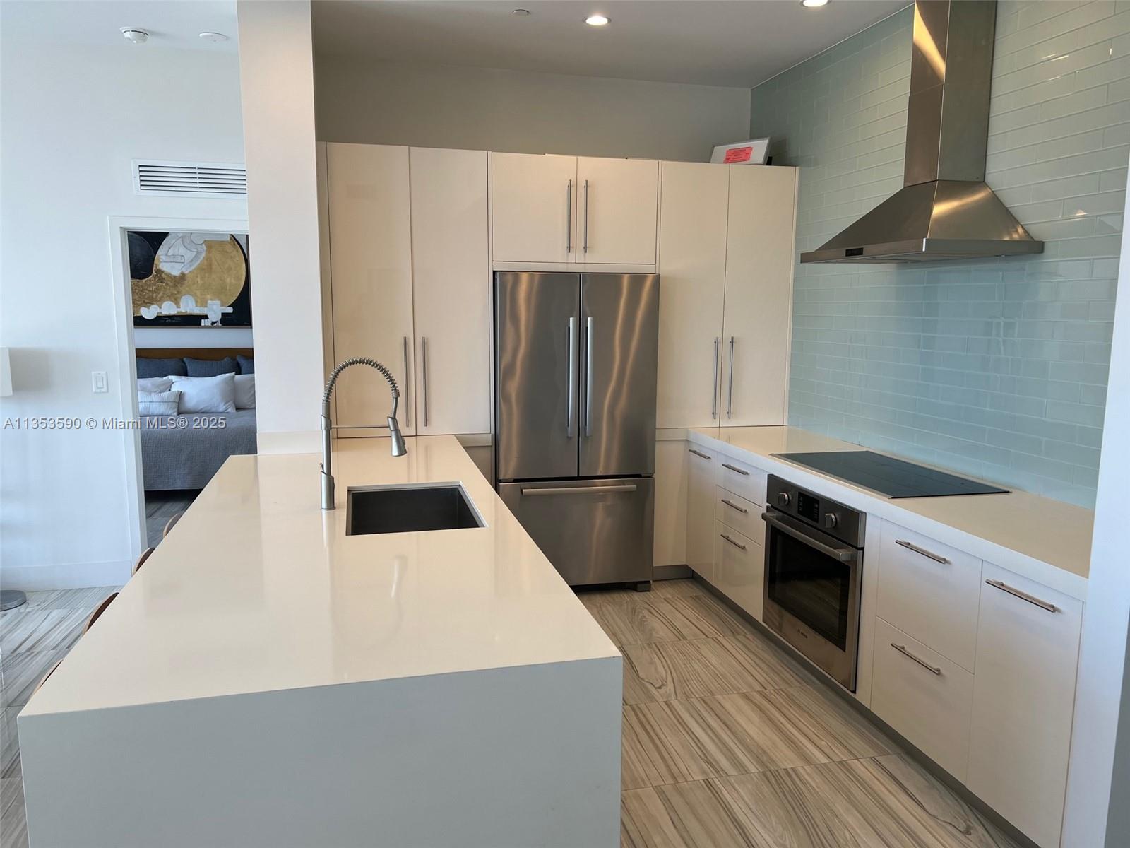 100 Lincoln Road, Unit PH9 Miami Beach, FL 33139 - Photo 19 of 83 a kitchen with stainless steel appliances a refrigerator sink and stove