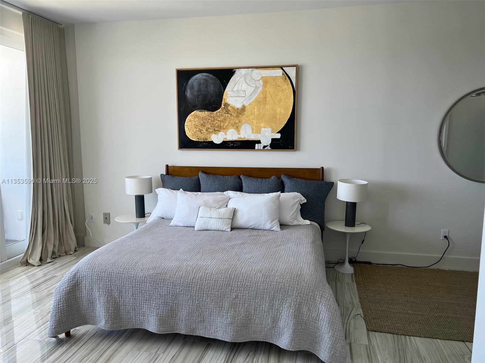 100 Lincoln Road, Unit PH9 Miami Beach, FL 33139 - Photo 22 of 83 a bedroom with a bed and painting on the wall
