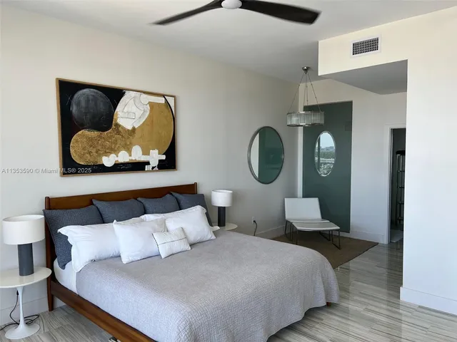 a bathroom with a sink shower and a mirror