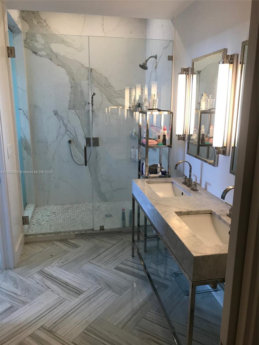 100 Lincoln Road, Unit PH9 Miami Beach, FL 33139 - Photo 32 of 83 a bathroom with a sink shower and a mirror