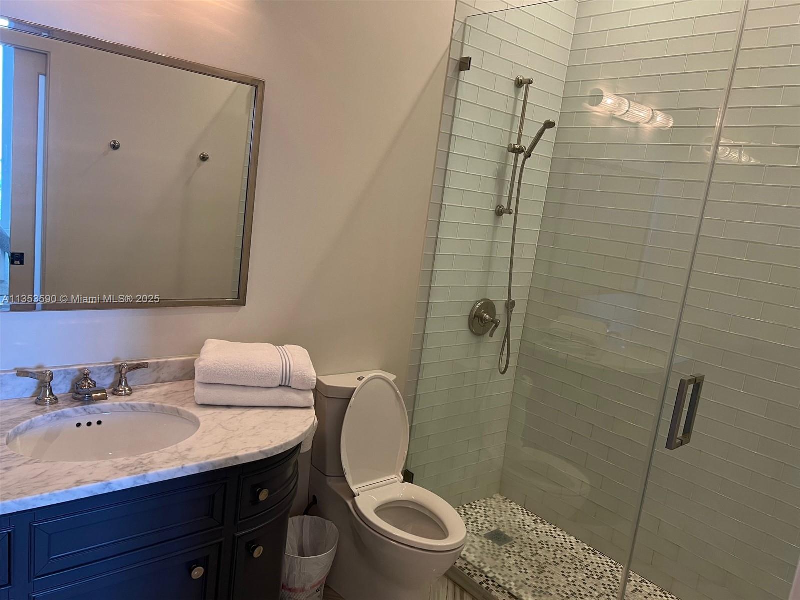 100 Lincoln Road, Unit PH9 Miami Beach, FL 33139 - Photo 39 of 83 a bathroom with a sink a toilet and shower