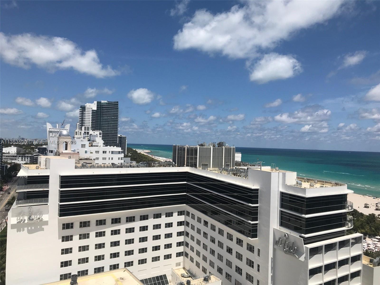 100 Lincoln Road, Unit PH9 Miami Beach, FL 33139 - Photo 48 of 83 a kitchen with a stove and a microwave