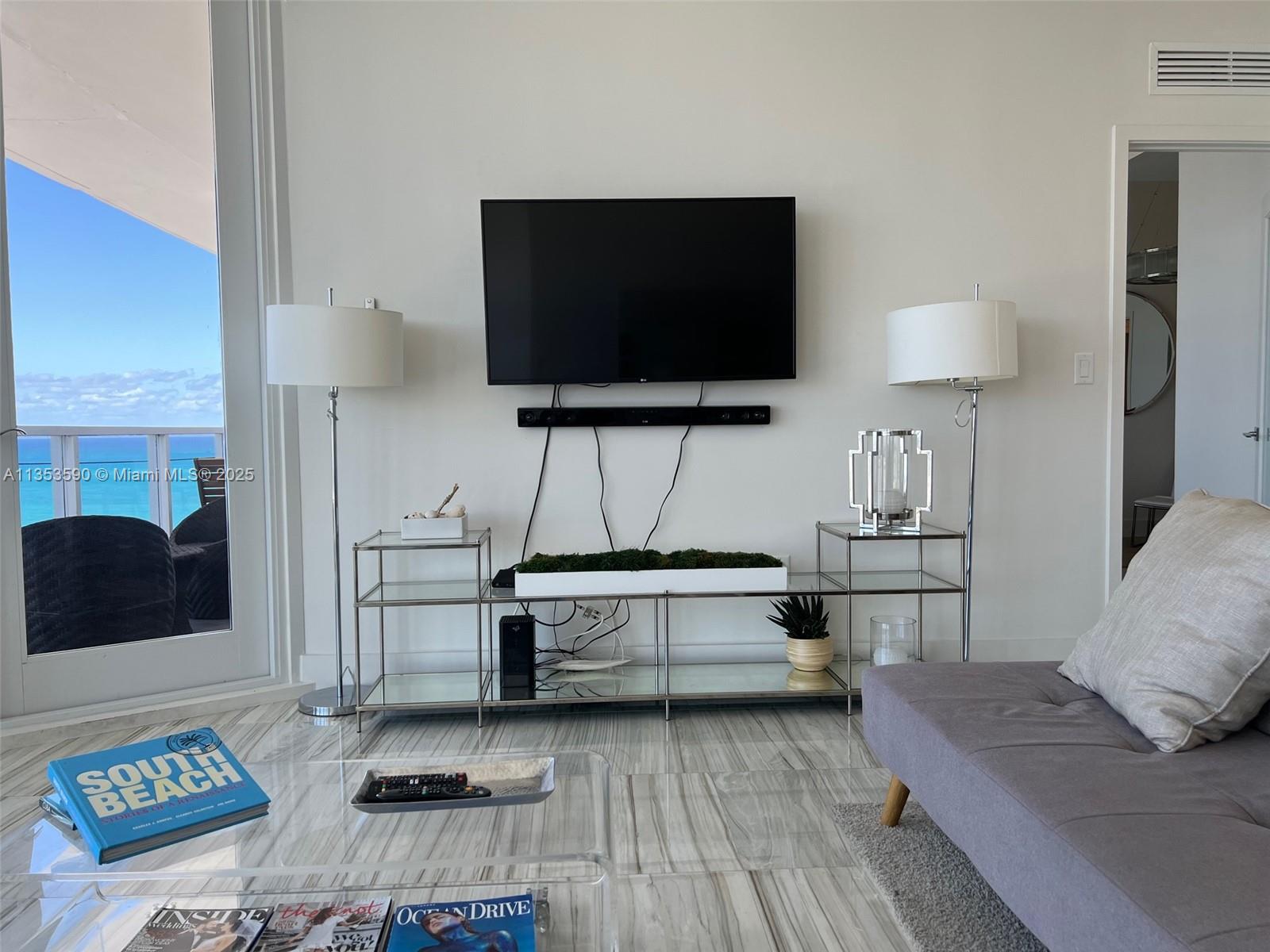 100 Lincoln Road, Unit PH9 Miami Beach, FL 33139 - Photo 8 of 83 a living room with furniture and a flat screen tv