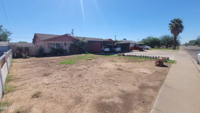 a pathway of a house with a yard