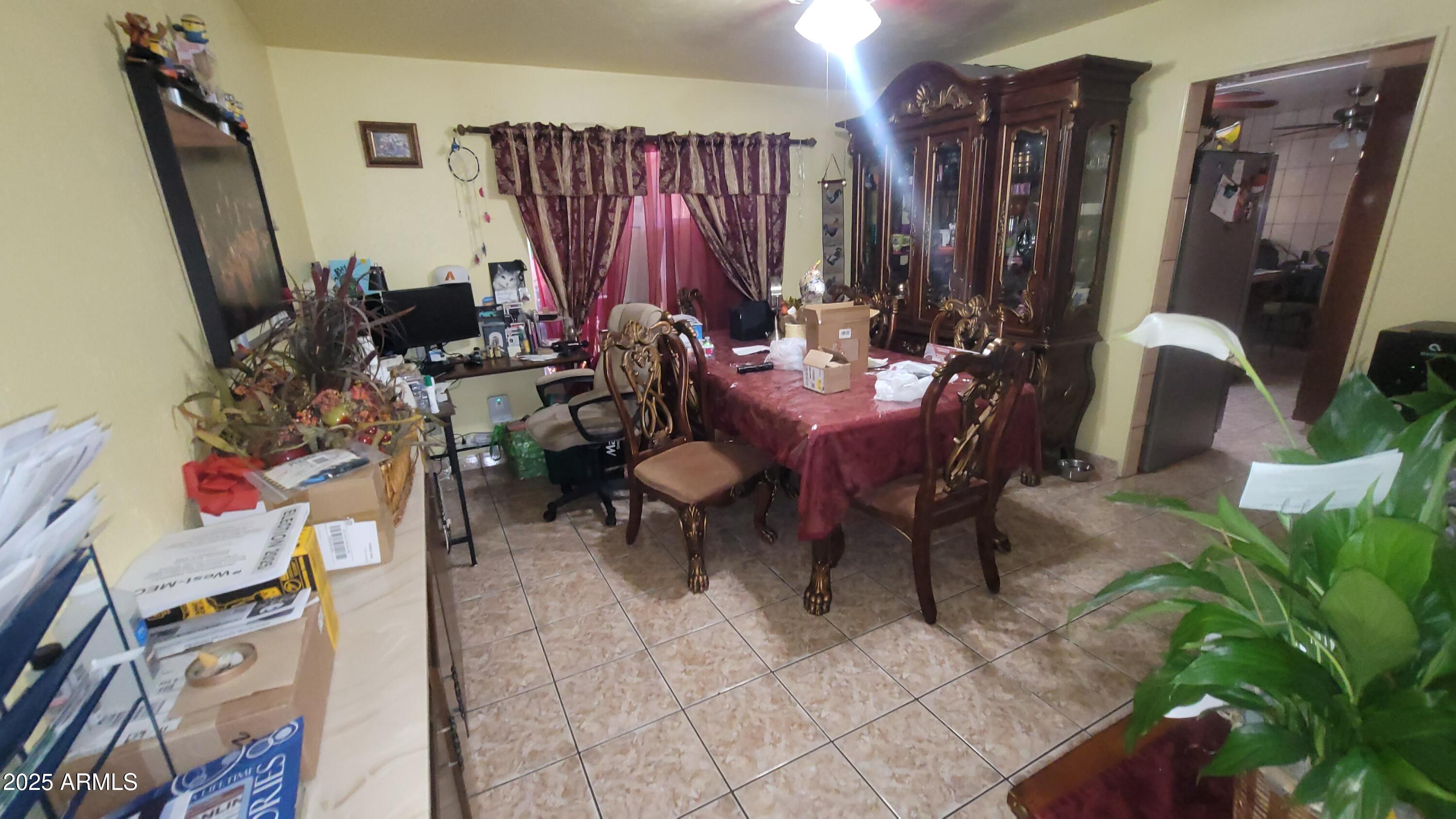 4315 West Osborn Road Phoenix, AZ 85031 - Photo 20 of 29 a view of a dining room with furniture and a rug