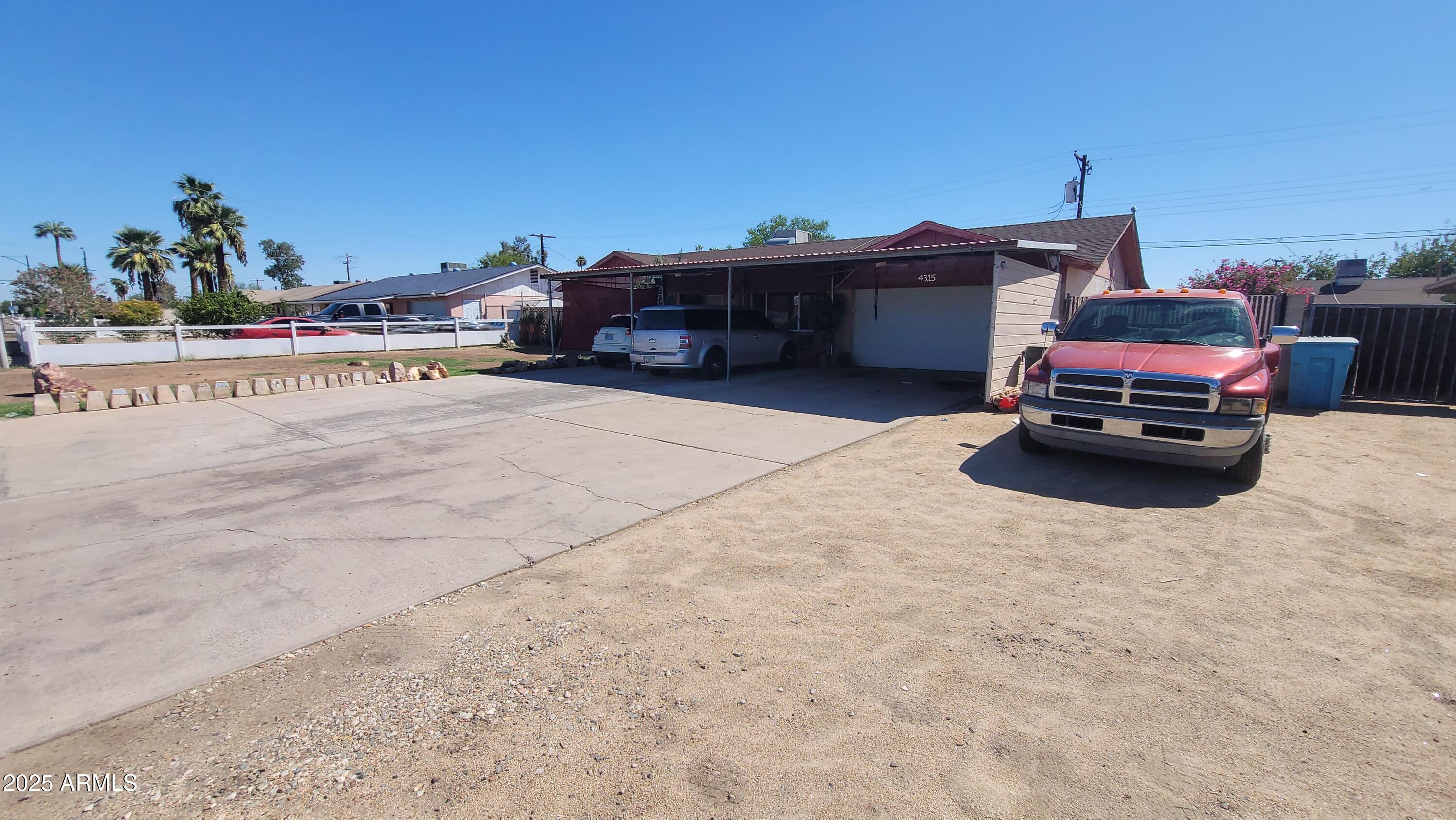 4315 West Osborn Road Phoenix, AZ 85031 - Photo 2 of 29 a car parked on the side of the road