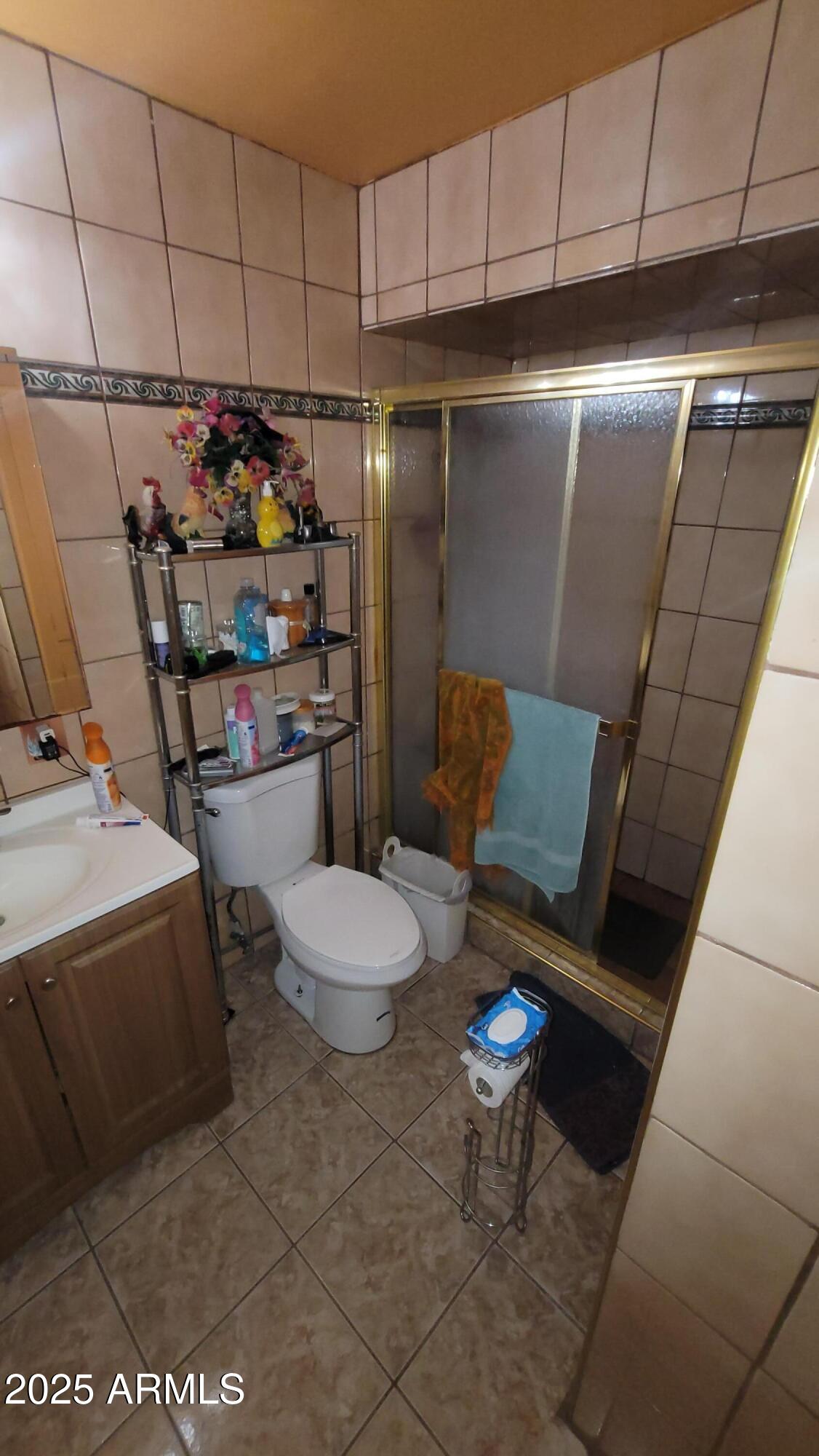 4315 West Osborn Road Phoenix, AZ 85031 - Photo 26 of 29 a kitchen with stainless steel appliances kitchen island granite countertop a sink and cabinets