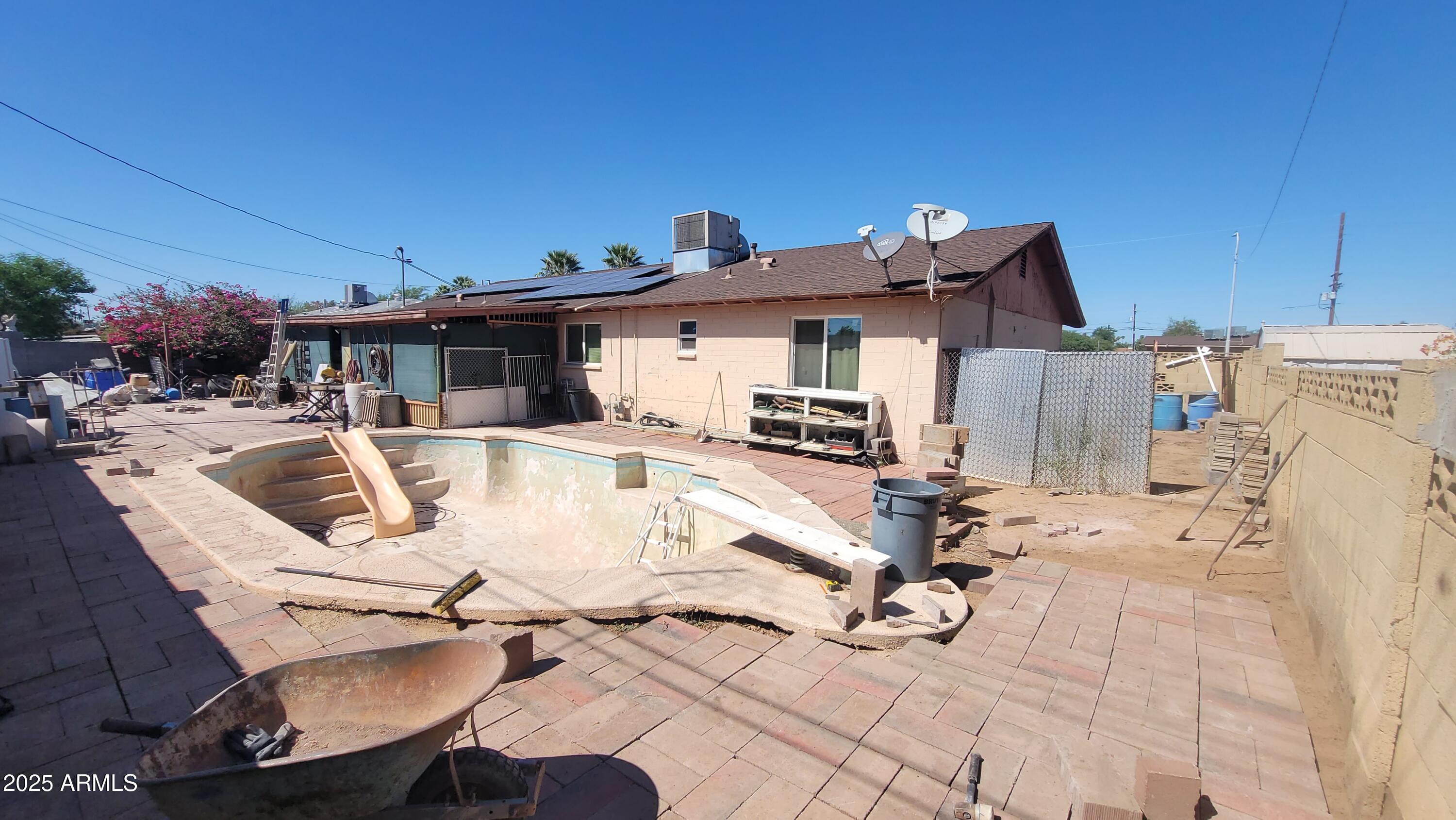 4315 West Osborn Road Phoenix, AZ 85031 - Photo 29 of 29 a view of a patio with swimming pool