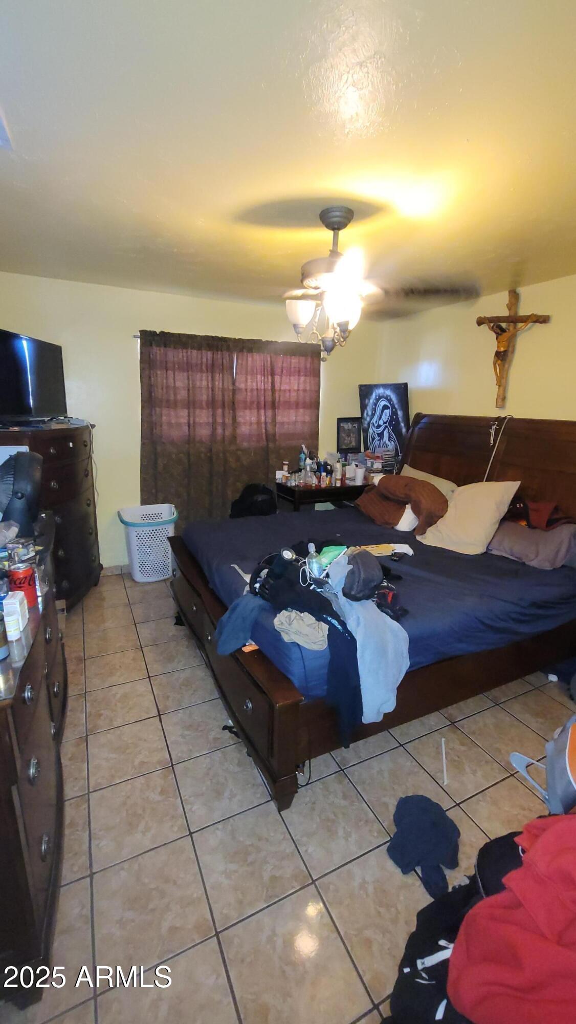 4315 West Osborn Road Phoenix, AZ 85031 - Photo 10 of 29 a living room with furniture and a couch