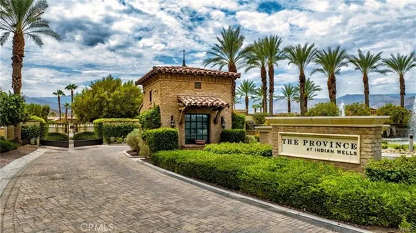 a kitchen with stainless steel appliances kitchen island granite countertop a stove a sink and a refrigerator