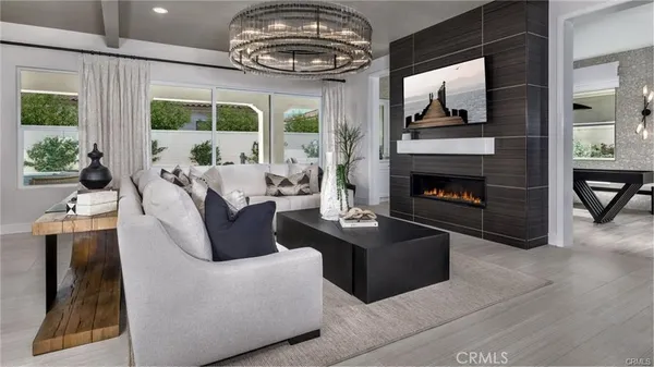 a living room with furniture fireplace and flat screen tv
