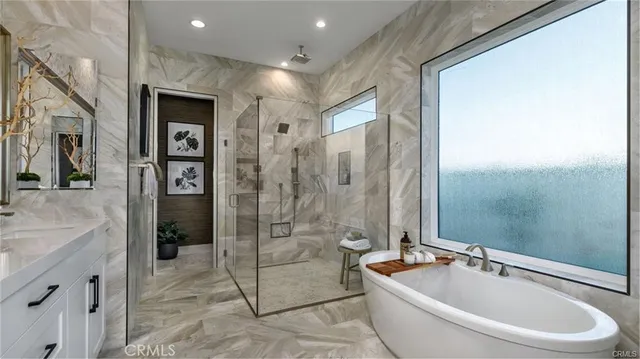 a spacious bathroom with a granite countertop tub a sink and a shower