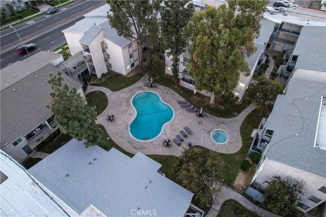 an aerial view of a house roof deck with furniture and a potted plant