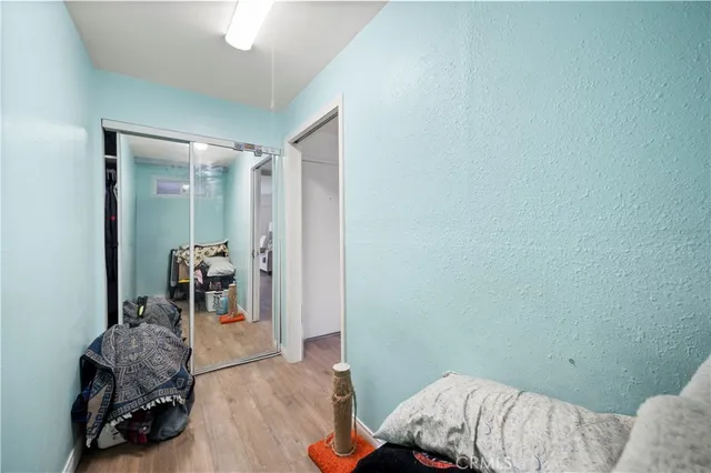 a bedroom with a bed and a chair