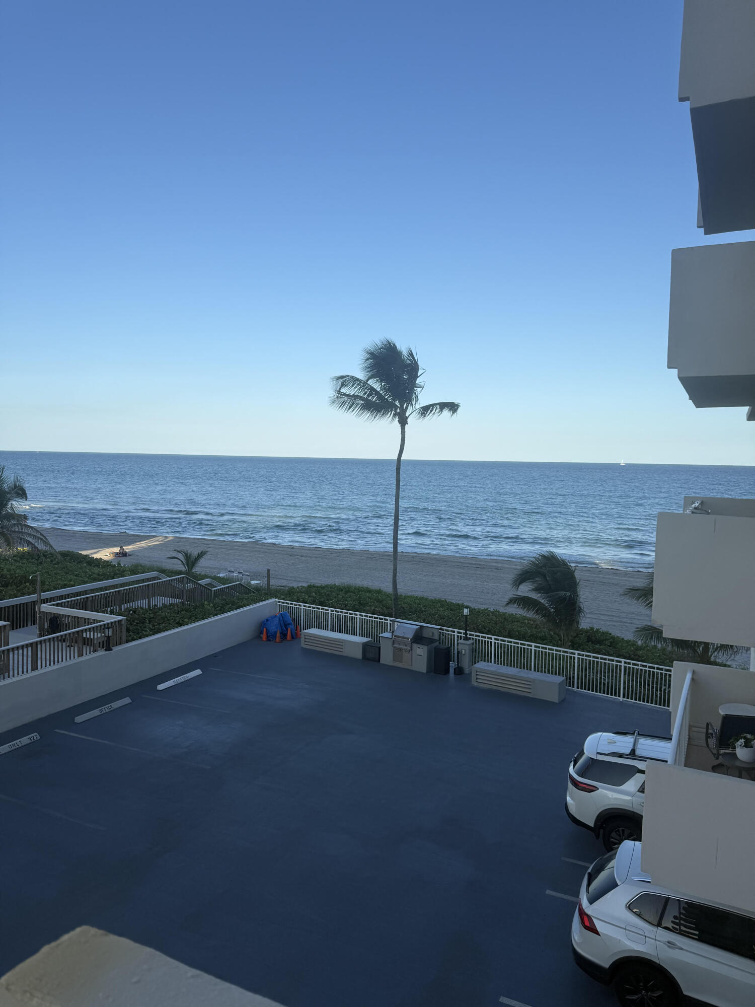 3215 South Ocean Boulevard, Unit 210 Highland Beach, FL 33487 - Photo 4 of 9 a view of a swimming pool with a table and chairs
