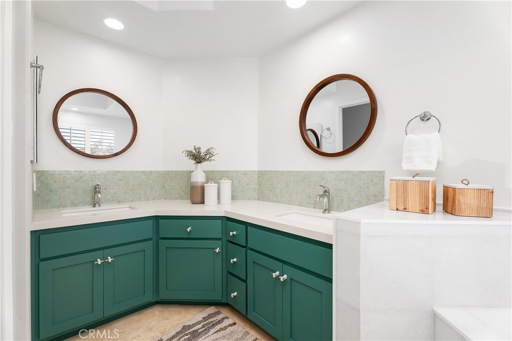 33113 Ocean Ridge Dana Point, CA 92629 - Photo 19 of 29 a bathroom with a granite countertop sink and a mirror