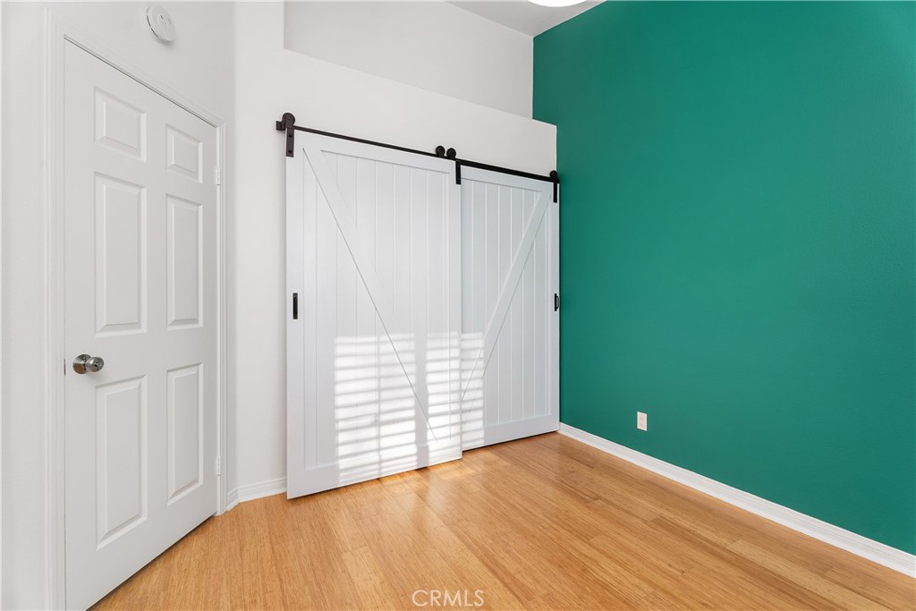 33113 Ocean Ridge Dana Point, CA 92629 - Photo 21 of 29 a view of empty room with wooden floor and fan