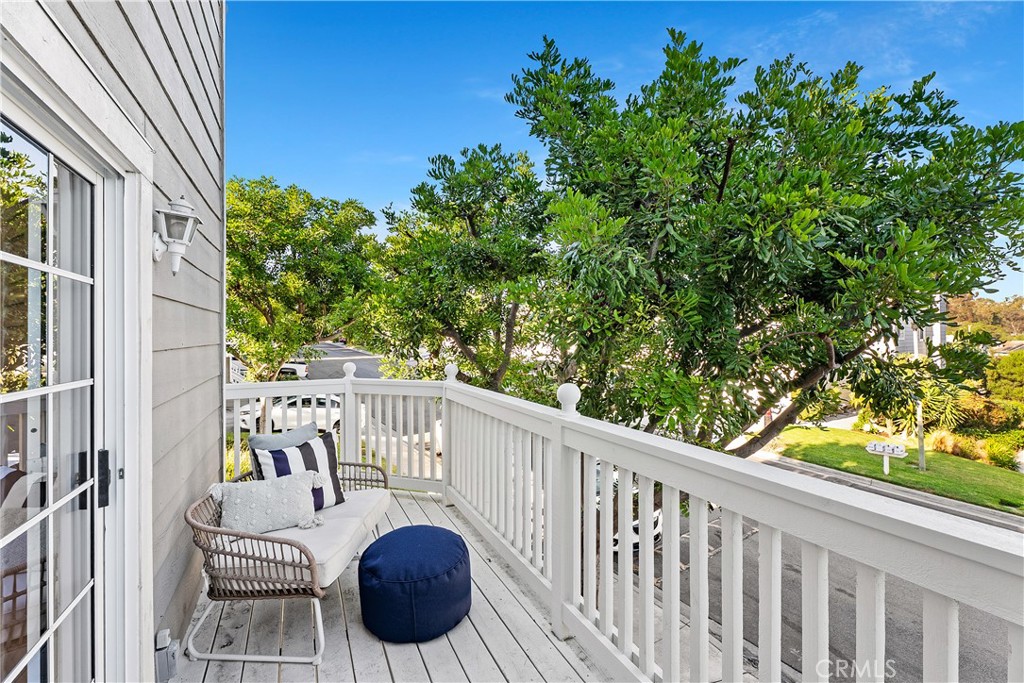 33113 Ocean Ridge Dana Point, CA 92629 - Photo 24 of 29 a view of balcony with wooden floor and outdoor seating