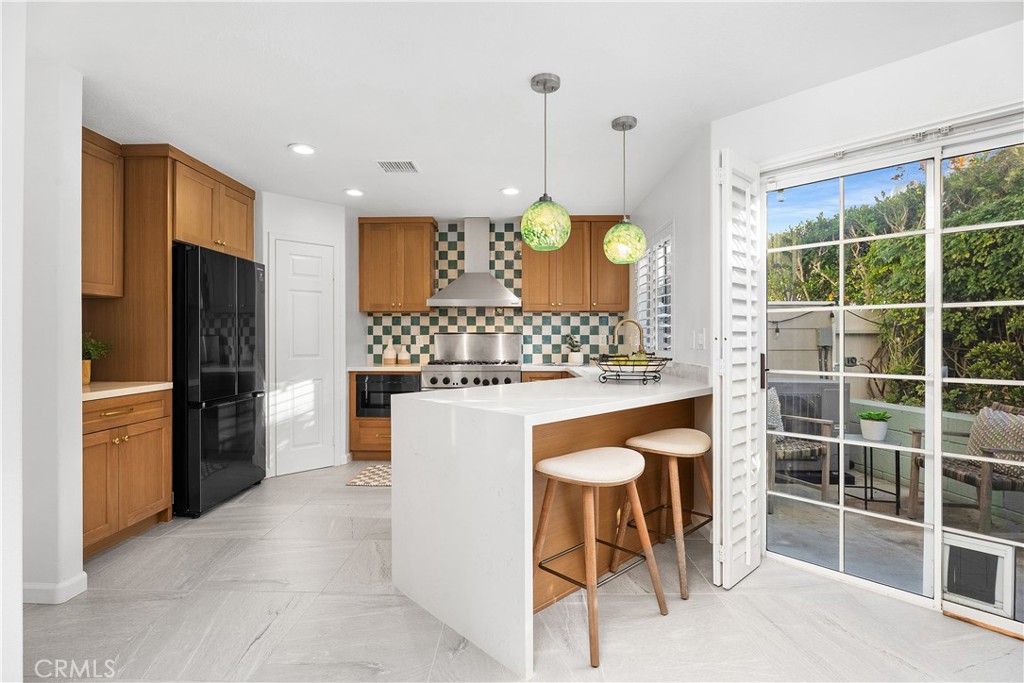 33113 Ocean Ridge Dana Point, CA 92629 - Photo 7 of 29 a kitchen with a refrigerator a oven and a sink