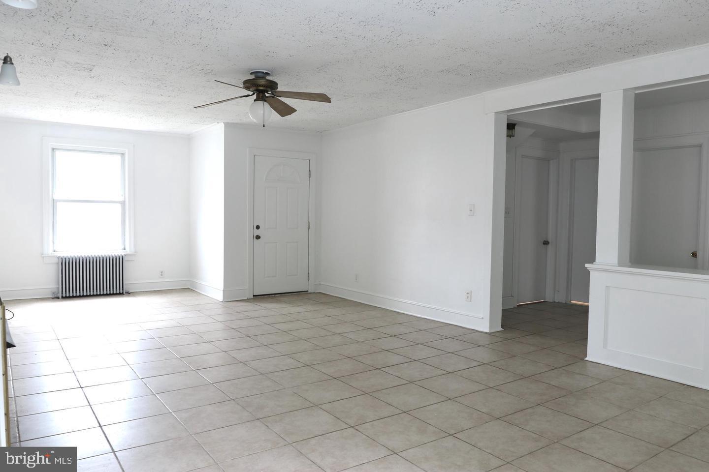 149 South Main Street, Unit 1 Elmer, NJ 08318 - Photo 9 of 14 a view of an empty room with a window