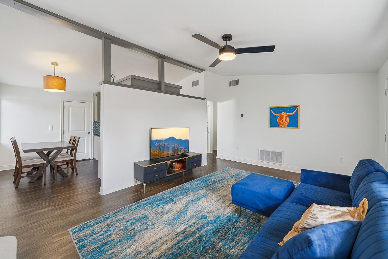 3705 Manorwood Road Austin, TX 78723 - Photo 3 of 13 a living room with furniture and a flat screen tv