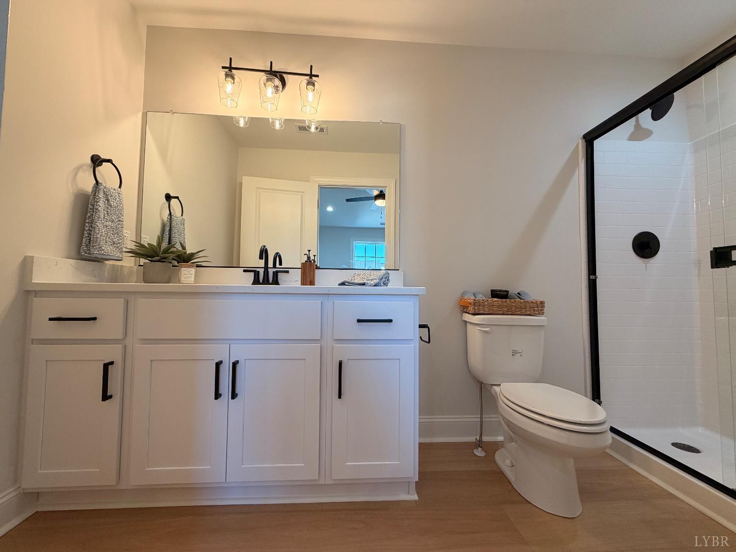 536 Leesville Road, Unit 207 Lynchburg, VA 24502 - Photo 21 of 35 a bathroom with a sink a toilet and a mirror